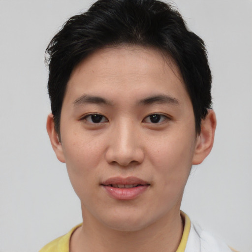 Joyful asian young-adult female with short  brown hair and brown eyes