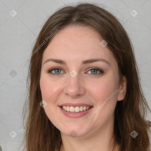 Joyful white young-adult female with long  brown hair and green eyes