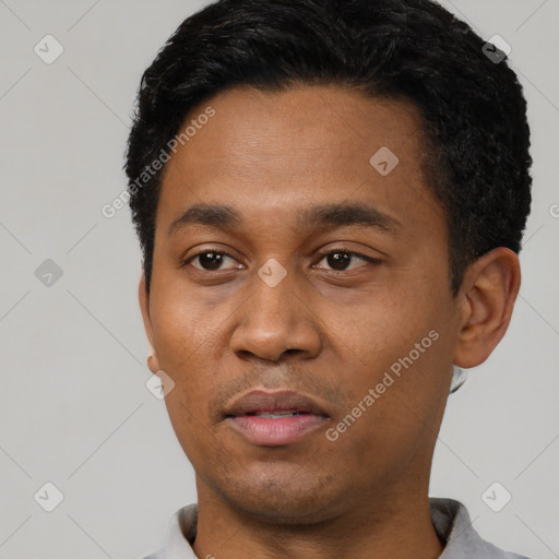 Neutral latino young-adult male with short  black hair and brown eyes