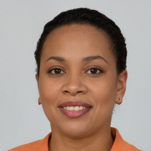 Joyful latino young-adult female with short  brown hair and brown eyes