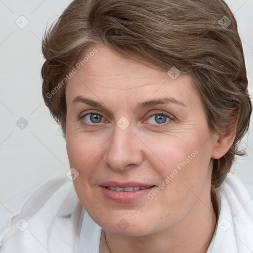 Joyful white adult female with medium  brown hair and blue eyes