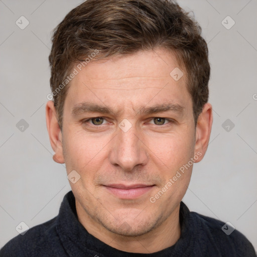 Joyful white adult male with short  brown hair and grey eyes