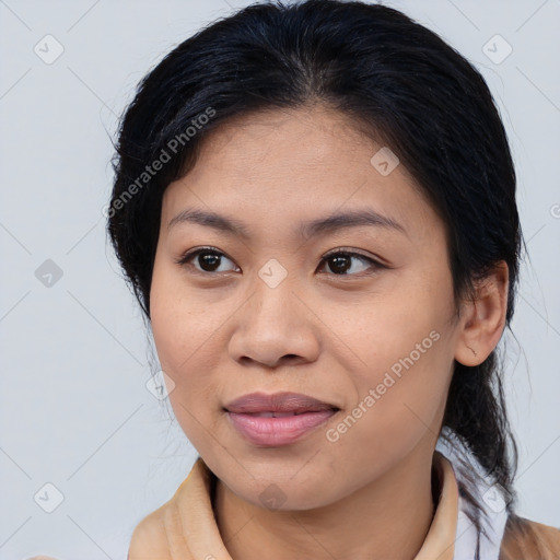 Joyful asian young-adult female with medium  brown hair and brown eyes