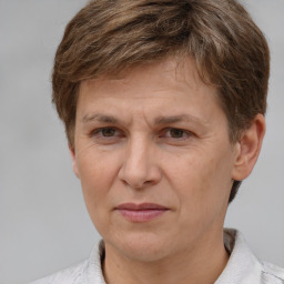 Joyful white adult female with short  brown hair and brown eyes