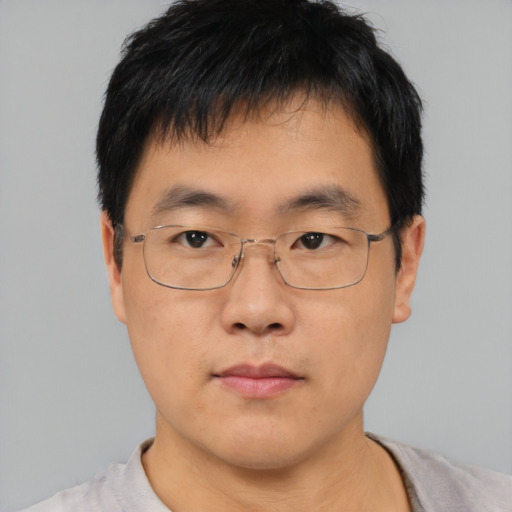 Neutral asian adult male with short  brown hair and brown eyes