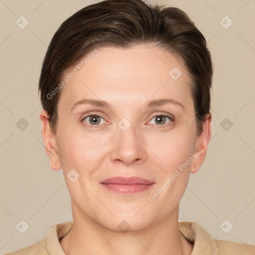 Joyful white adult female with short  brown hair and grey eyes