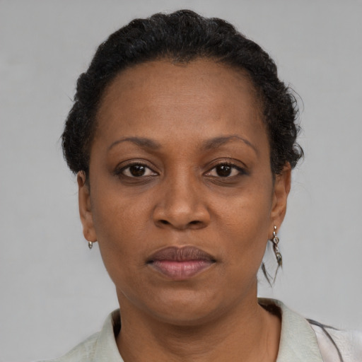 Neutral black adult female with short  brown hair and brown eyes