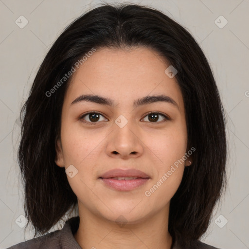 Joyful latino young-adult female with medium  brown hair and brown eyes