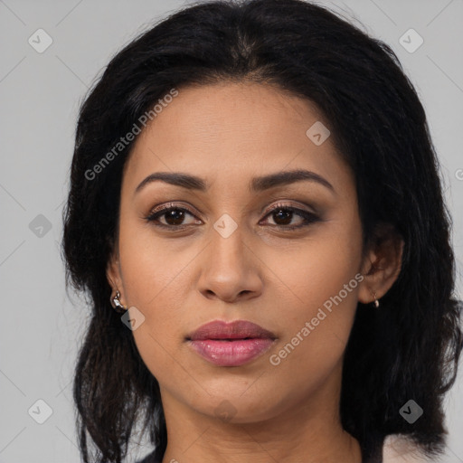 Joyful latino young-adult female with long  brown hair and brown eyes