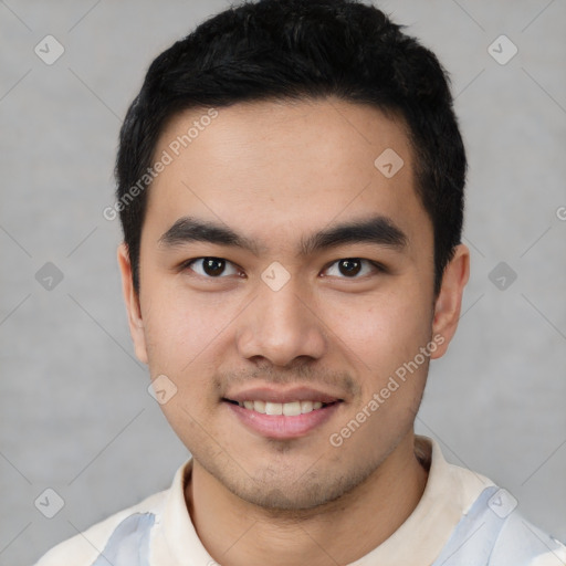 Joyful latino young-adult male with short  brown hair and brown eyes