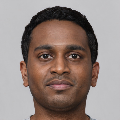 Neutral black young-adult male with short  black hair and brown eyes