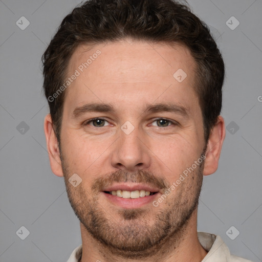 Joyful white adult male with short  brown hair and brown eyes