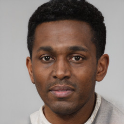 Neutral black young-adult male with short  black hair and brown eyes