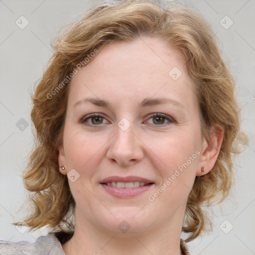 Joyful white young-adult female with medium  brown hair and blue eyes