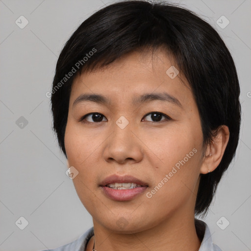 Joyful asian young-adult female with medium  black hair and brown eyes