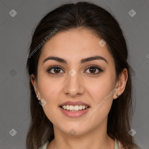 Joyful white young-adult female with long  brown hair and brown eyes