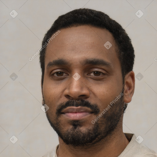 Neutral black young-adult male with short  black hair and brown eyes