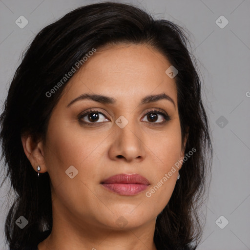 Joyful latino young-adult female with long  brown hair and brown eyes