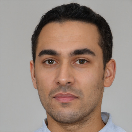 Neutral latino young-adult male with short  black hair and brown eyes