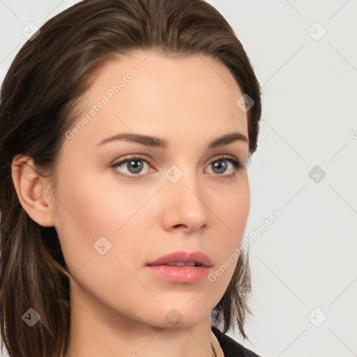 Neutral white young-adult female with long  brown hair and brown eyes