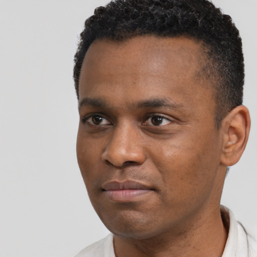 Neutral black adult male with short  black hair and brown eyes