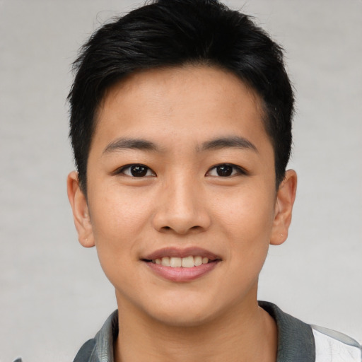 Joyful asian young-adult male with short  black hair and brown eyes