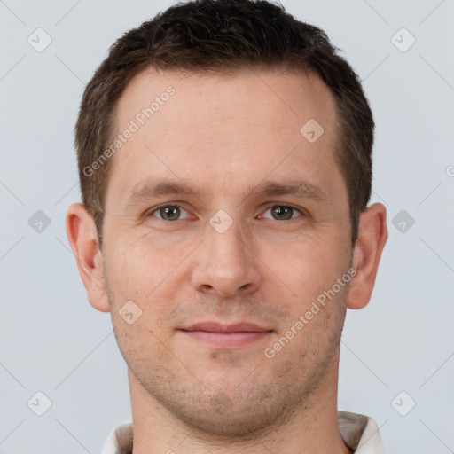 Joyful white young-adult male with short  brown hair and brown eyes