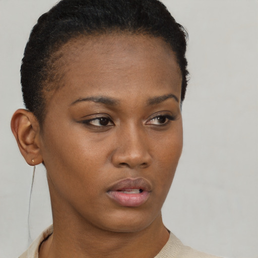 Neutral black young-adult female with short  brown hair and brown eyes