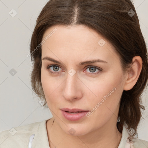 Neutral white young-adult female with medium  brown hair and grey eyes