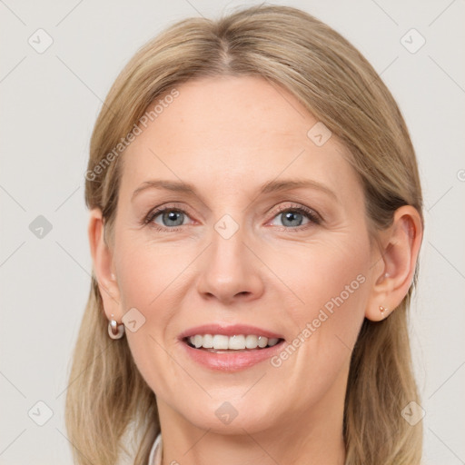 Joyful white adult female with medium  brown hair and grey eyes