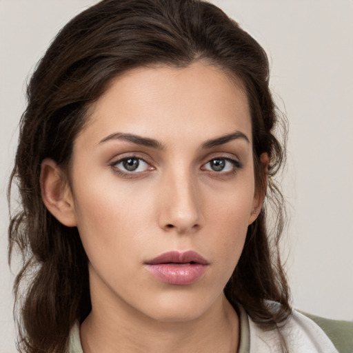 Neutral white young-adult female with medium  brown hair and brown eyes