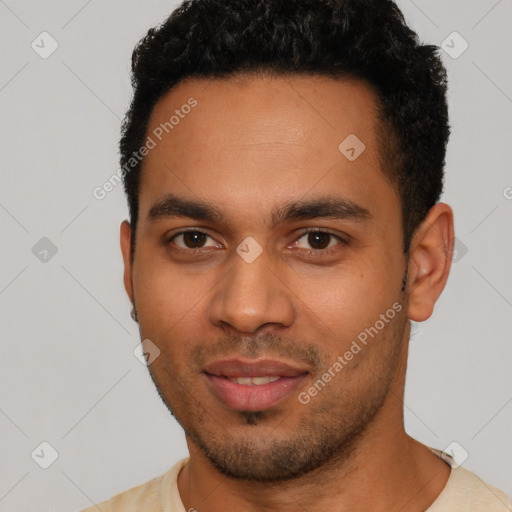 Joyful latino young-adult male with short  brown hair and brown eyes