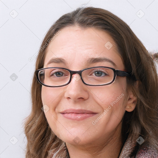 Joyful white young-adult female with long  brown hair and blue eyes