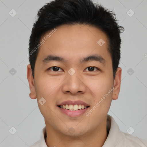 Joyful asian young-adult male with short  brown hair and brown eyes