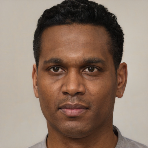 Neutral black young-adult male with short  black hair and brown eyes