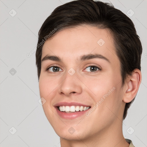 Joyful white young-adult female with short  brown hair and brown eyes