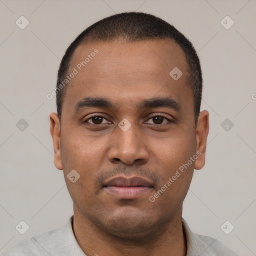 Neutral latino young-adult male with short  black hair and brown eyes
