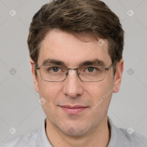 Joyful white adult male with short  brown hair and grey eyes