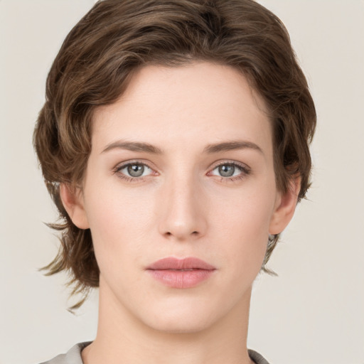 Neutral white young-adult female with medium  brown hair and green eyes