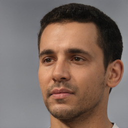 Neutral white young-adult male with short  black hair and brown eyes