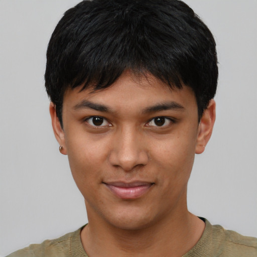 Joyful asian young-adult male with short  black hair and brown eyes