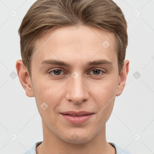 Joyful white young-adult male with short  brown hair and grey eyes