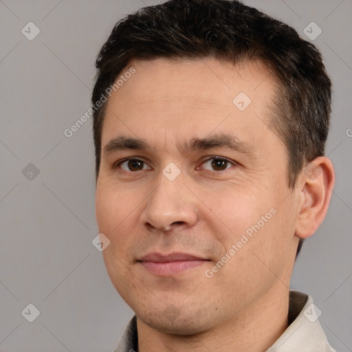 Joyful white adult male with short  brown hair and brown eyes