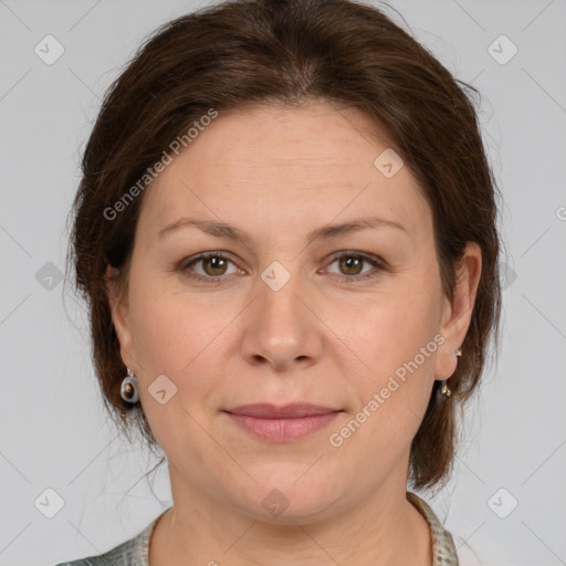 Joyful white adult female with medium  brown hair and grey eyes