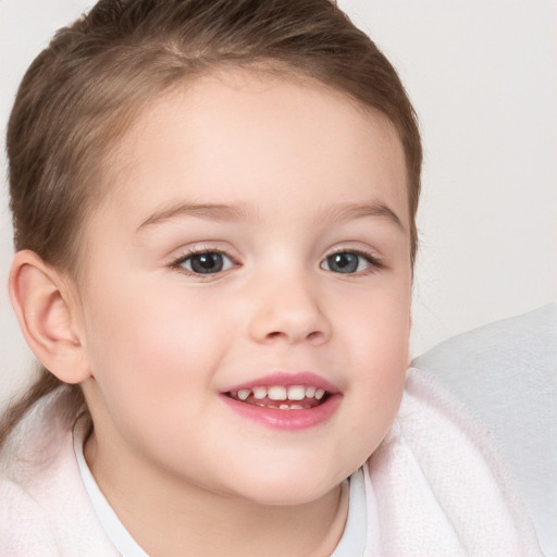 Joyful white child female with medium  brown hair and brown eyes