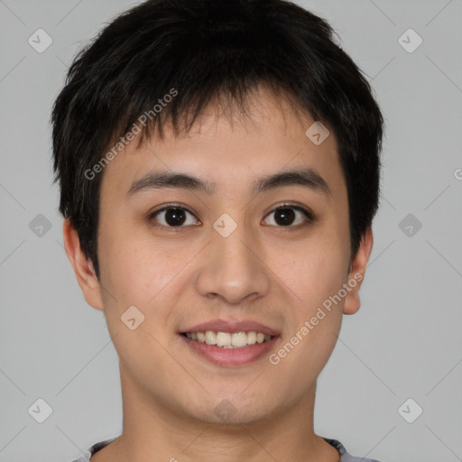 Joyful asian young-adult male with short  brown hair and brown eyes