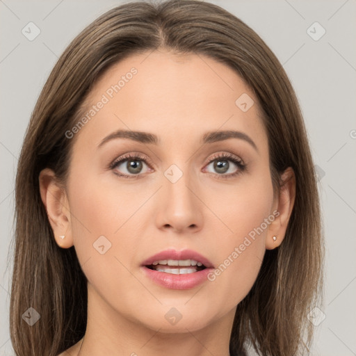 Joyful white young-adult female with long  brown hair and grey eyes