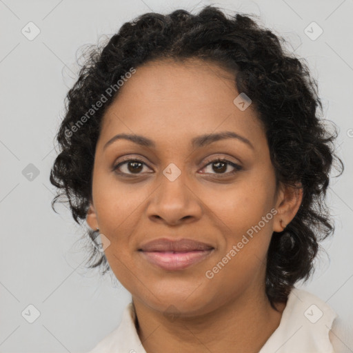 Joyful black adult female with medium  brown hair and brown eyes