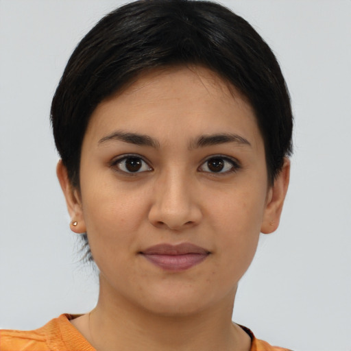 Joyful latino young-adult female with short  brown hair and brown eyes