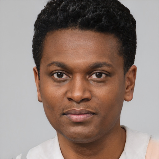 Neutral black young-adult male with short  black hair and brown eyes